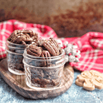 These spiced candied pecans are a perfect way to snack through the holidays. These pecans can be packaged up in mason jars to make a perfect gift for friends and family. #paleo #glutenfree #dairyfree