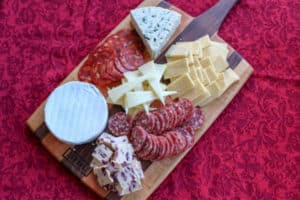 Cheese plates make a great visually appealing appetizer that caters to many tastes. This is how to make a simple cheese plate for a small gathering or party.