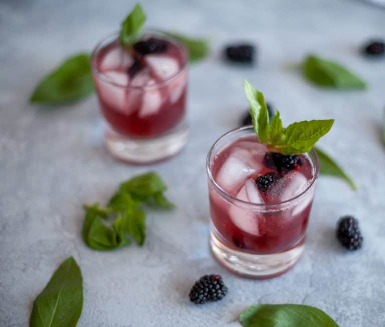 This blackberry basil mocktail may be lacking alcohol but it does not lack flavor!  The combination of blackberry, basil and lime sparkling water make a tart and sweet drink great for any party or to have at home without the hangover. 
