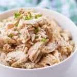 all purpose shredded chicken in a white bowl