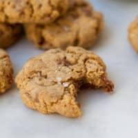 Gluten Free Doubletree Chocolate Chip Cookies and one with a bite taken out