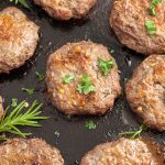 ground beef breakfast sausage patties in a skillet