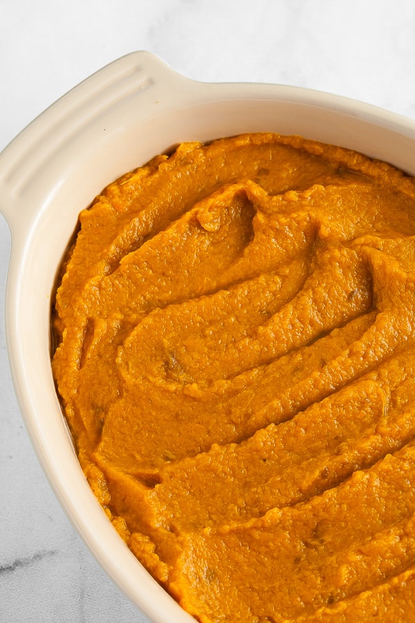 mashed sweet potatoes in a white dish