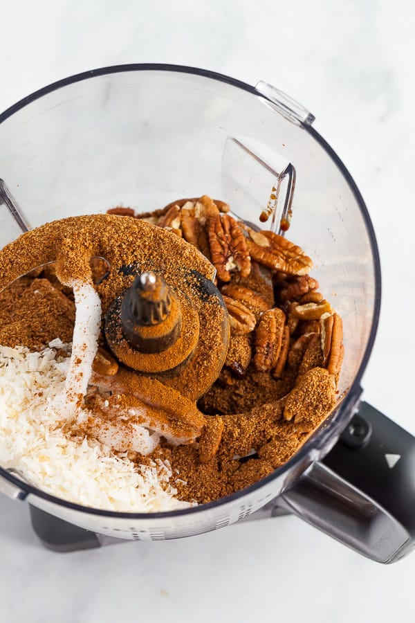 pecans, coconut, and other ingredients in a food processor