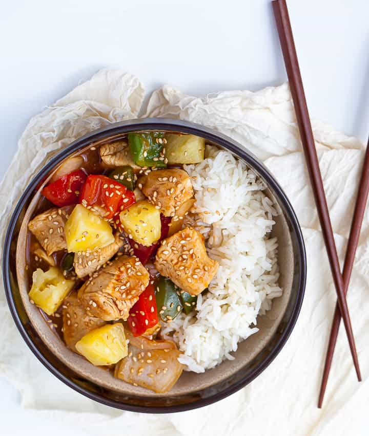 Healthy Sweet and Sour Chicken on rice  with chopsticks