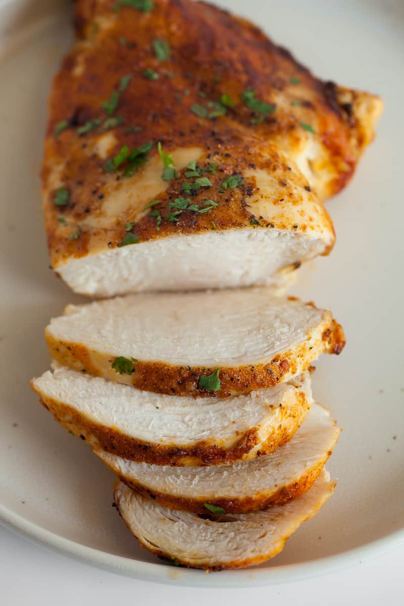 cooked chicken breast on a white plate