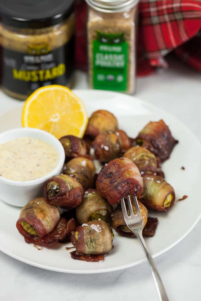 bacon wrapped brussels sprouts on a plate