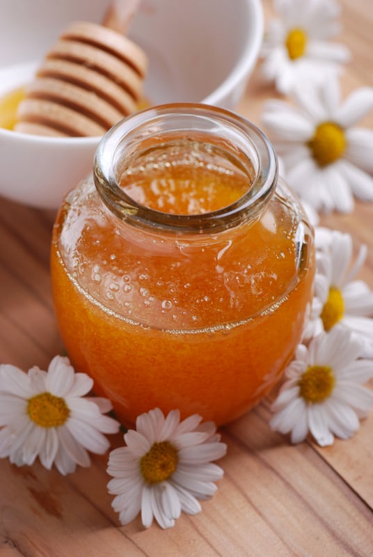 raw honey with daisies