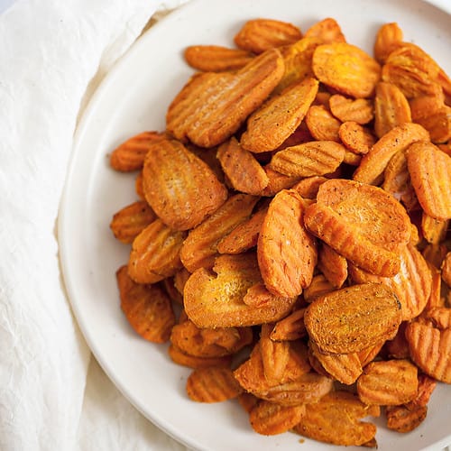 cooked carrot chips on a plate