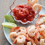 cocktail sauce with shrimp and lime