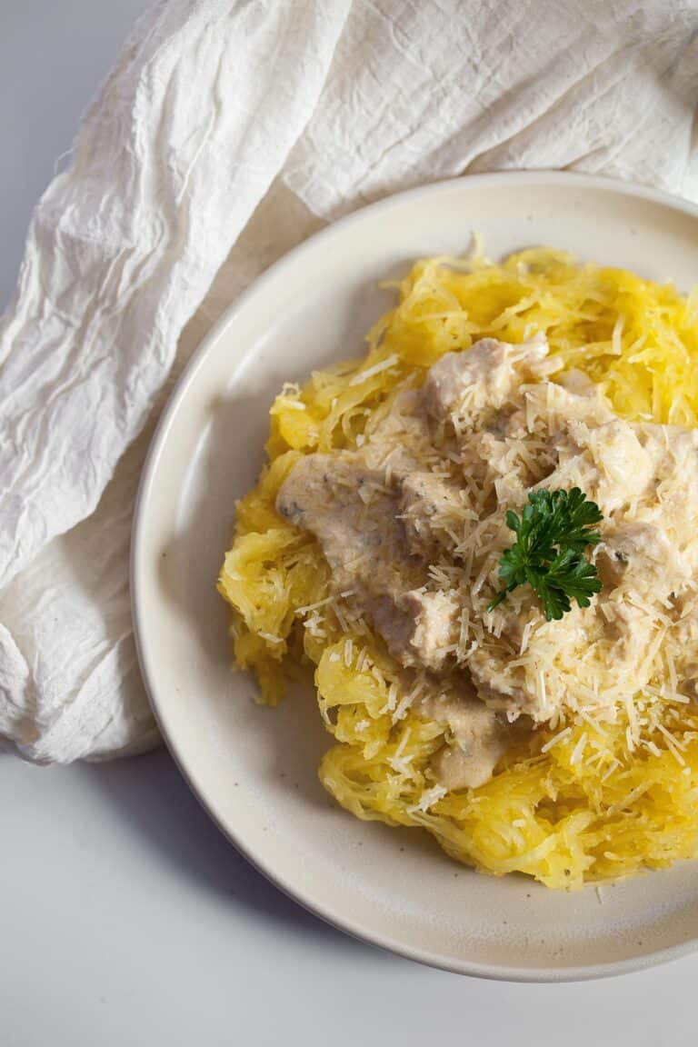 garlic parmesan chicken on top of spaghetti squash