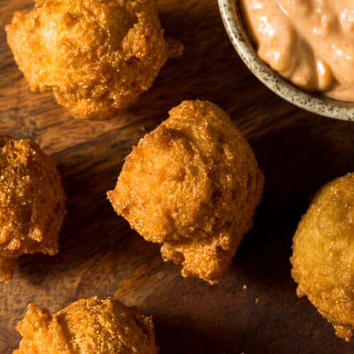 cooked hush puppies with dipping sauce