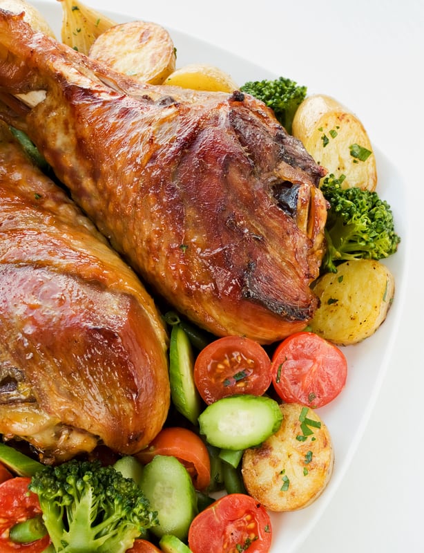 cooked turkey legs with vegetables