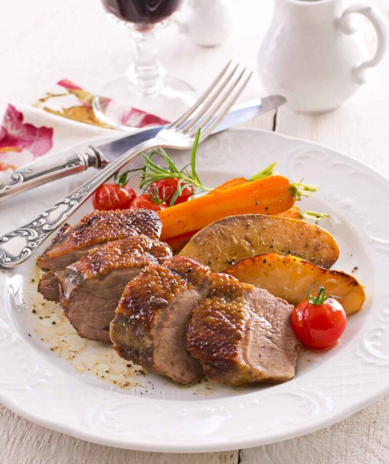 roasted duck breast on a plate