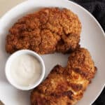 air fryer tyson southern chicken tenderloins on a white plate with dipping sauce