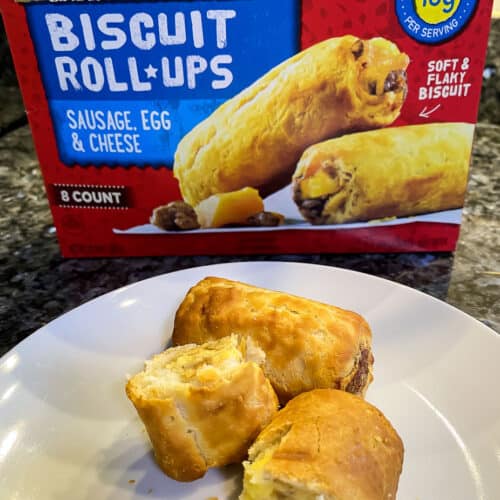 jimmy dean biscuit roll-ups on a white plate next to packaging