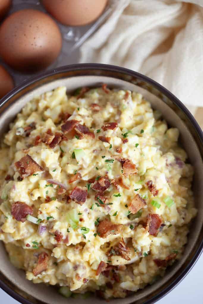 egg salad in a bowl with bacon and ranch