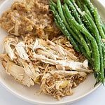 chicken, stuffing, and green beans on a plate