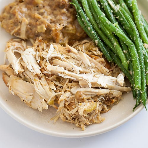 chicken, stuffing, and green beans on a plate