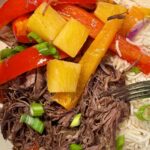 shredded pot roast with peppers, pineapple, and rice cooked in a crock pot