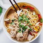 bowl with peanut noodles, chicken and vegetables