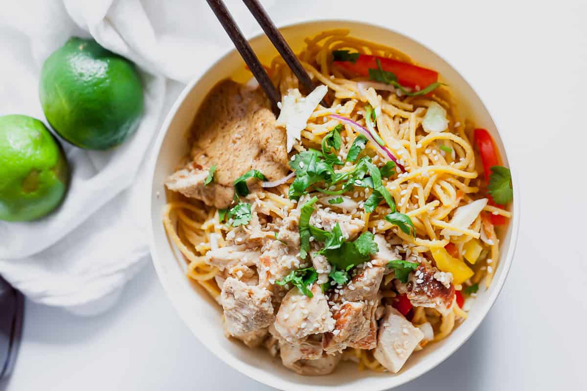 bowl with peanut noodles, chicken and vegetables